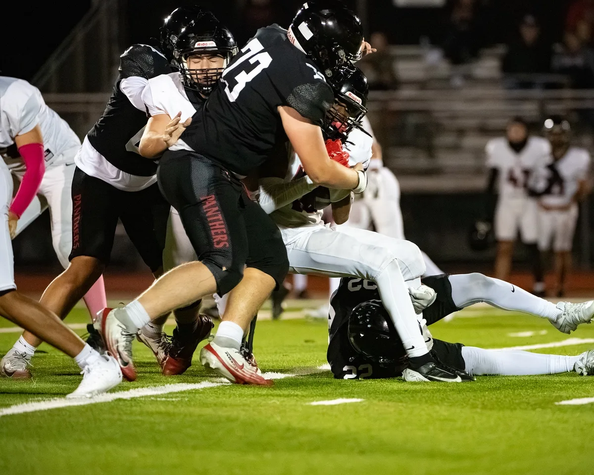 Ben Payne (#73) finishing a downfield block during a game against Burleson