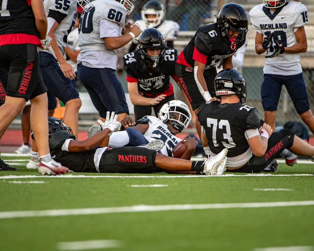Ben Payne (#73) driving off the line at the snap during a game against Richland