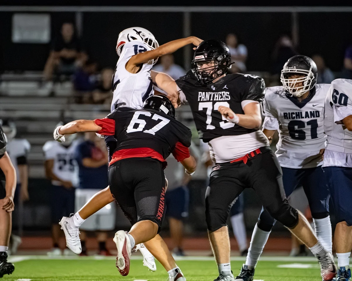 Ben Payne (#73) locking up a pass rusher in the backfield during a game against Richland