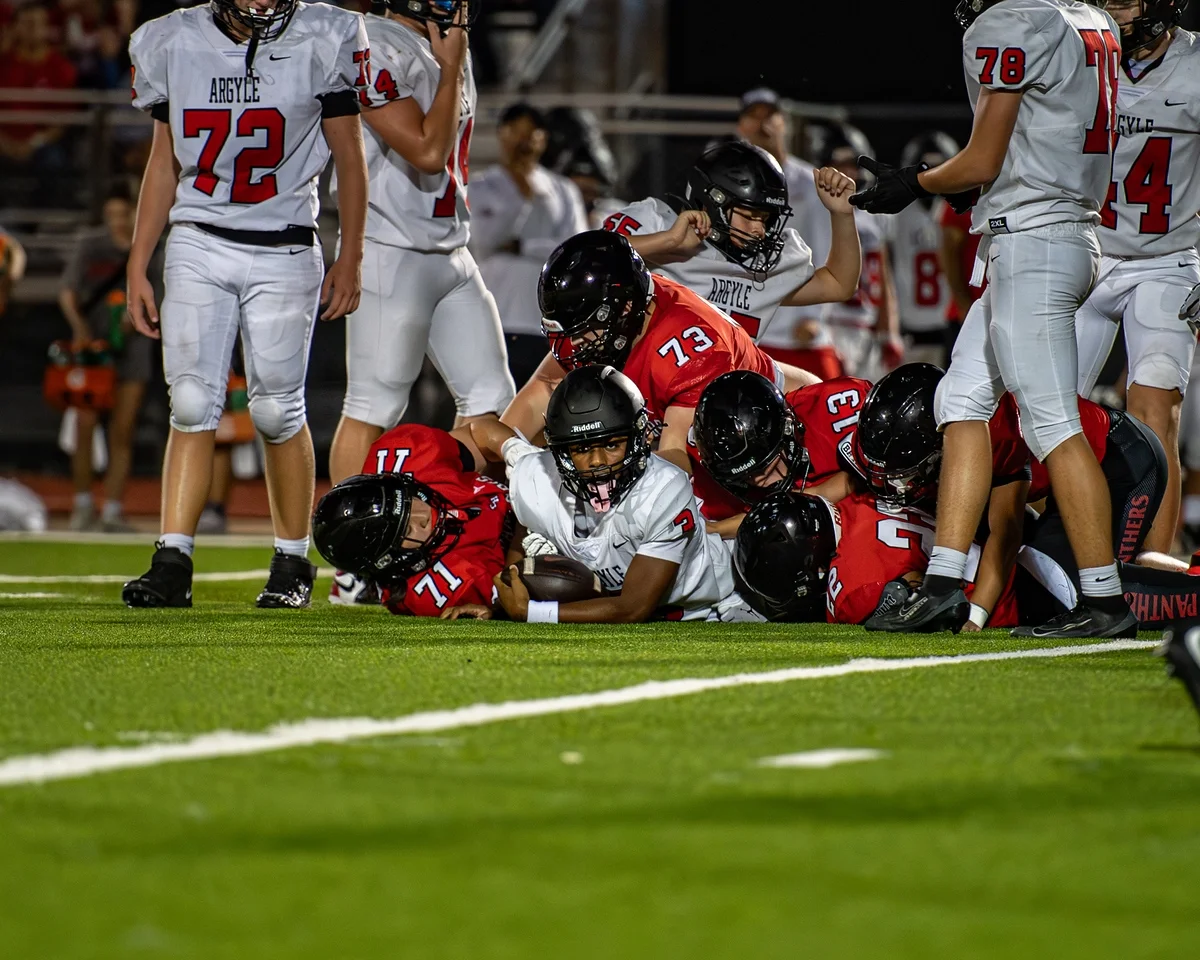 Ben Payne (#73) in on the pile at the goal line during a game against Argyle