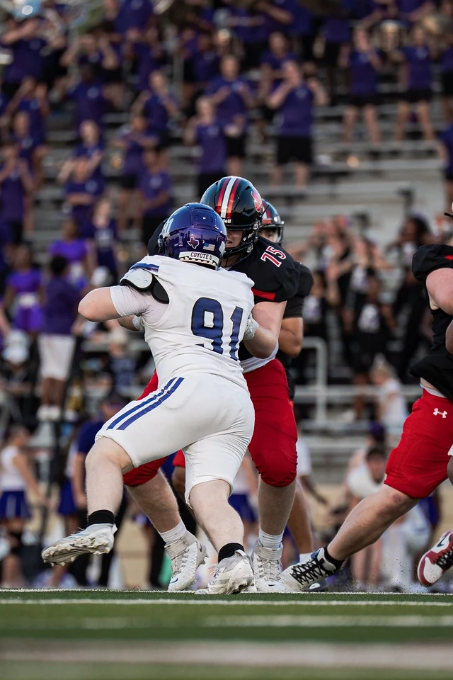 Ben Payne (#75) pass blocking during his varsity debut for Colleyville Heritage against Anna