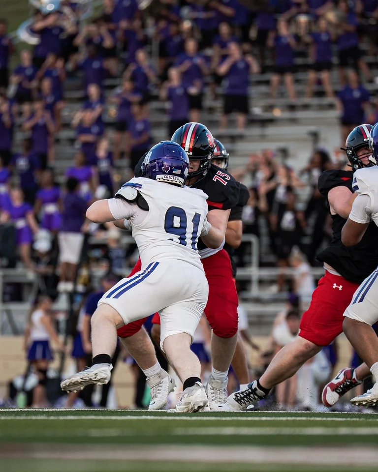 Ben Payne (#75) pass blocking during his varsity debut against Anna
