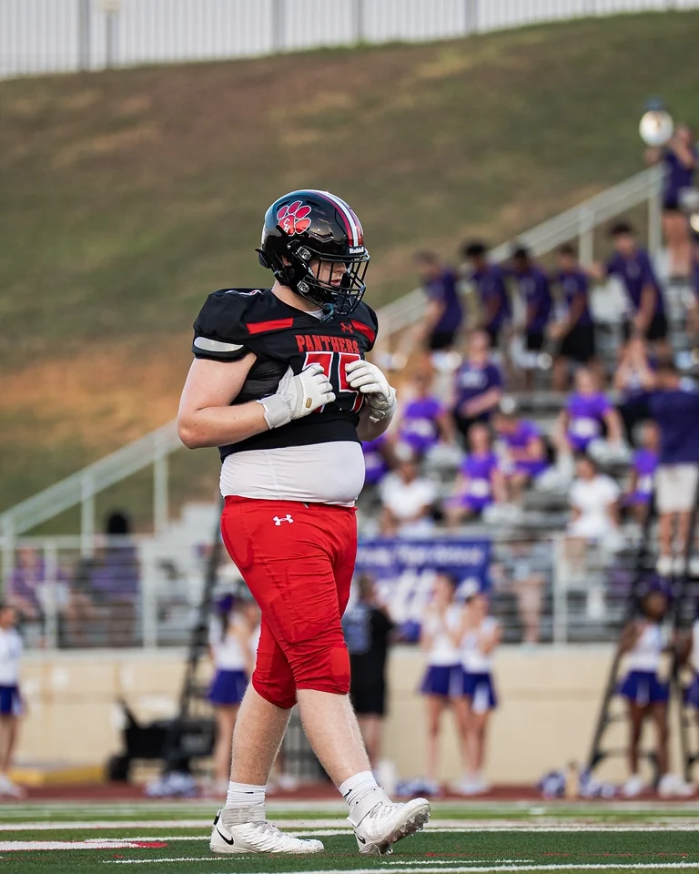 Ben Payne (#75) walking off the field during his varsity debut against Anna